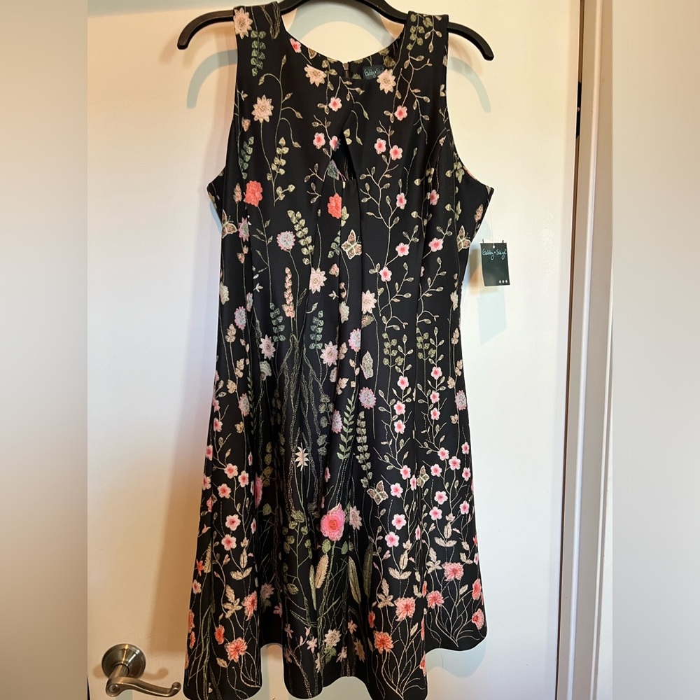 Brand new with tags Gabby Skye flare floral dress. Size 6.